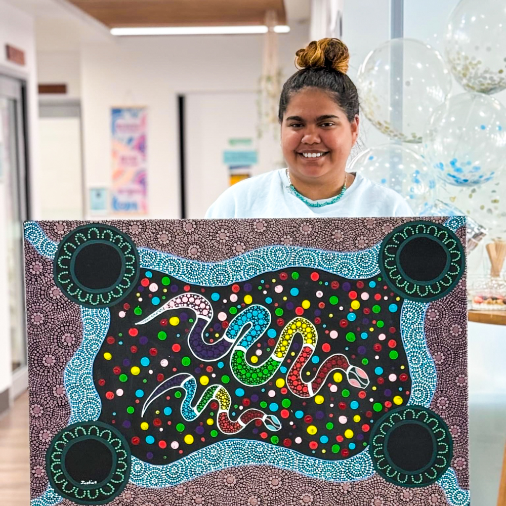 woman standing in front of art